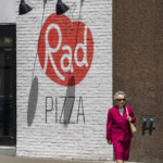 Cool looking lady walking past Rad Pizza